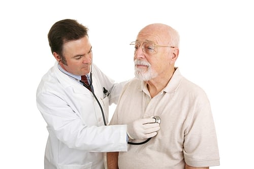 Elderly man getting his heart checked out by a doctor in Burlington, VT